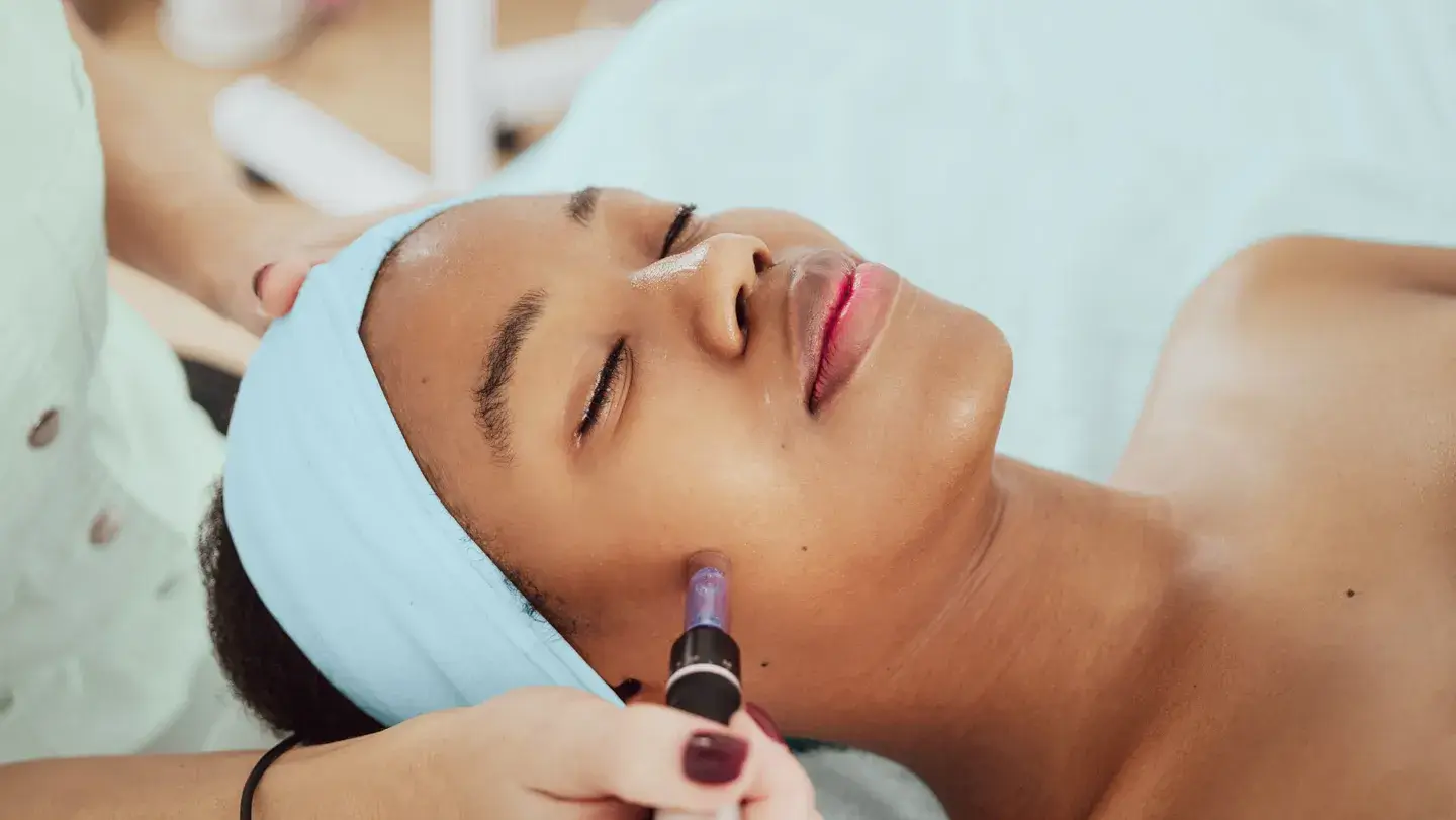 Professional spa facial therapy with natural skincare products